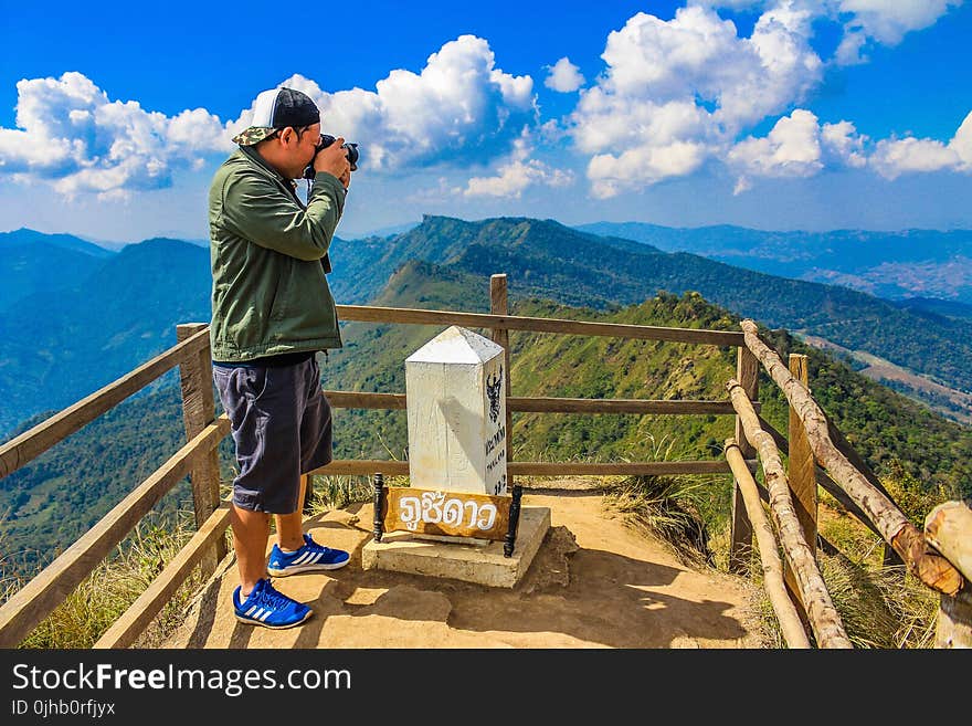 Photo of Man Taking Pictures