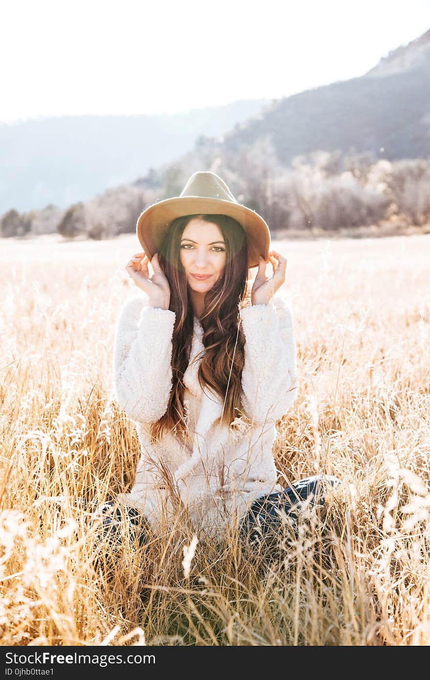 Photography of Woman on Brown Field