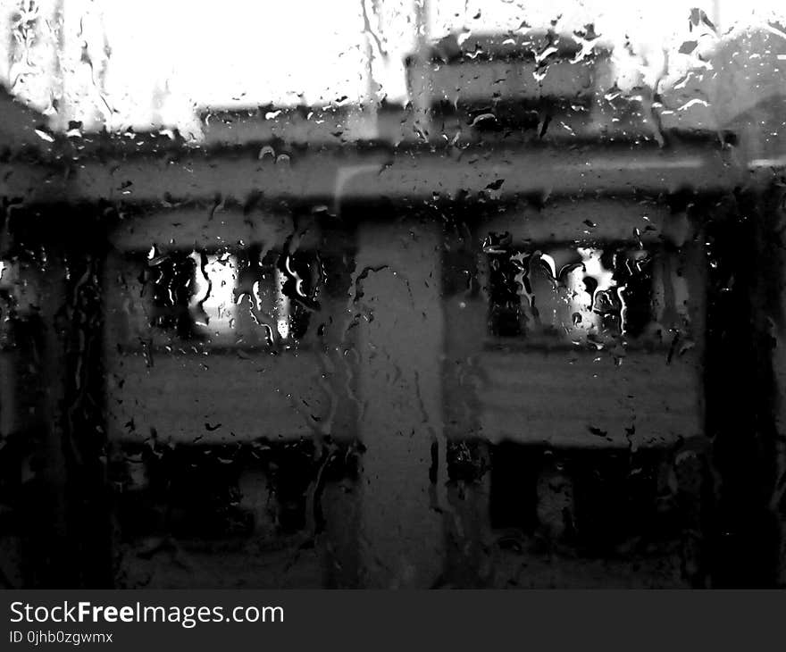 Rain Pouring on Glass Window