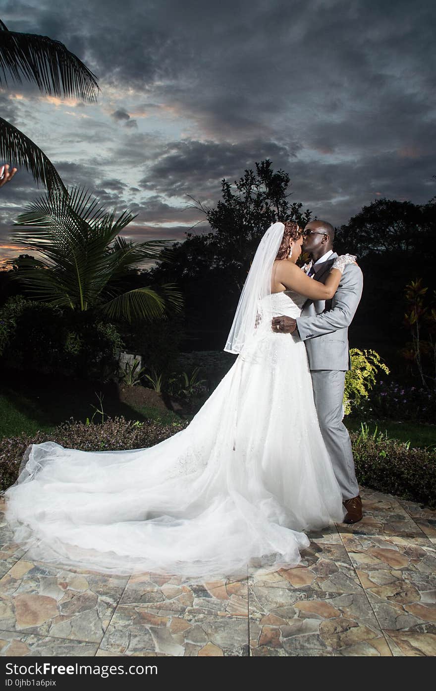 Photo of a Man Kissing His Wife