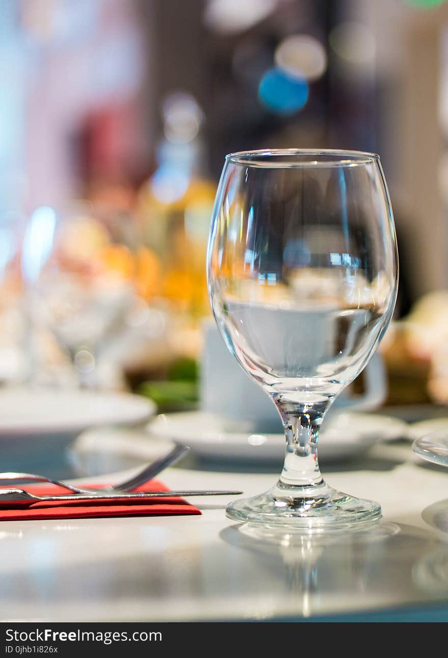 Selective Focus Photography of Clear Wine Glass