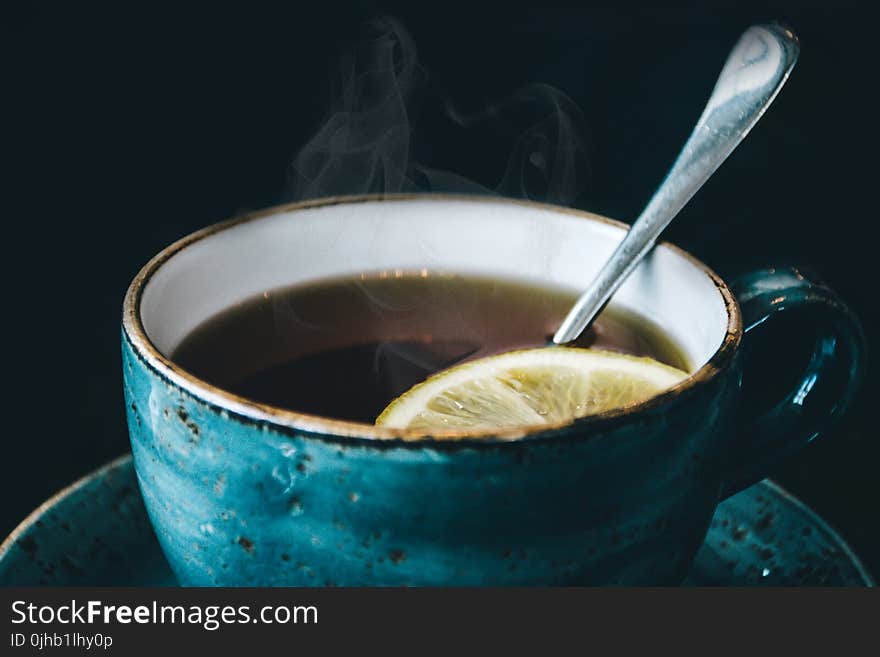 Photography of Blue Ceramic Coffee Cup