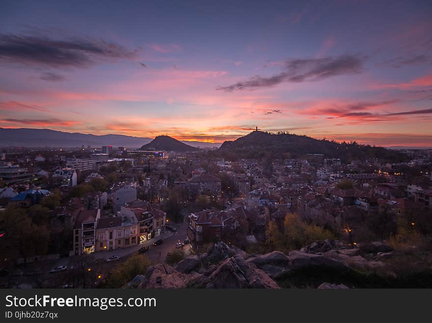 Top View Of Houses And Mountain During Sunset