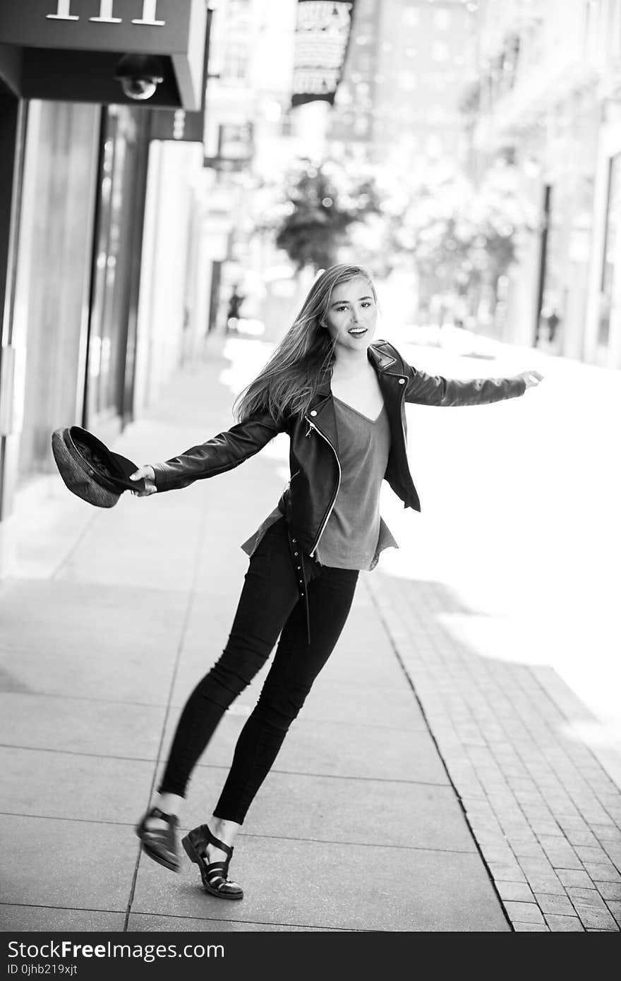 Woman Wearing Black Leather Jacket Grayscale Photo