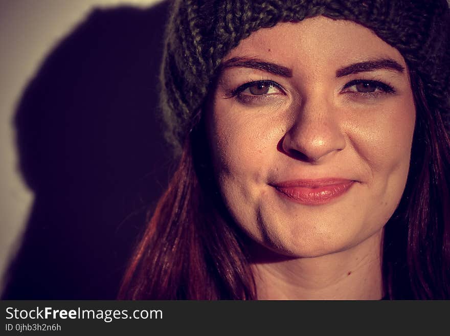 Woman Wearing Black Beanie Smiling for Photo