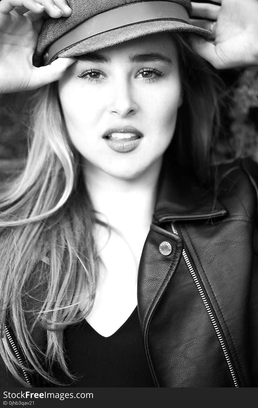 Black and White Photo of a Woman Wearing Leather Jacket