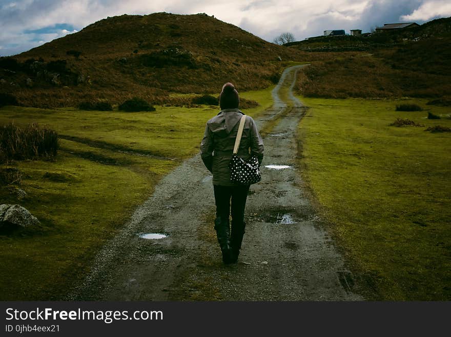 Person Standing in Pathway