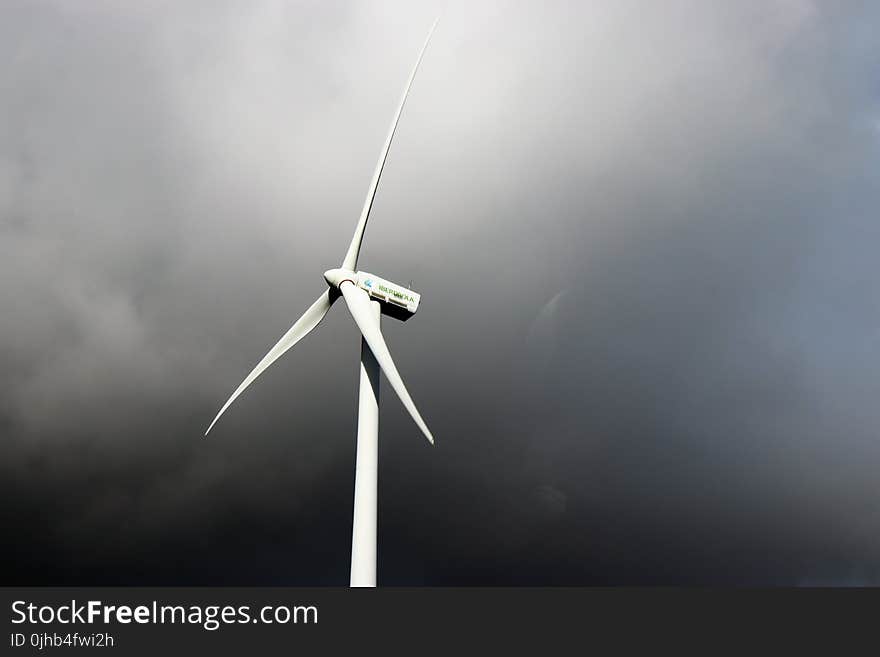 White Windmill Under Gray Cloudy Sky