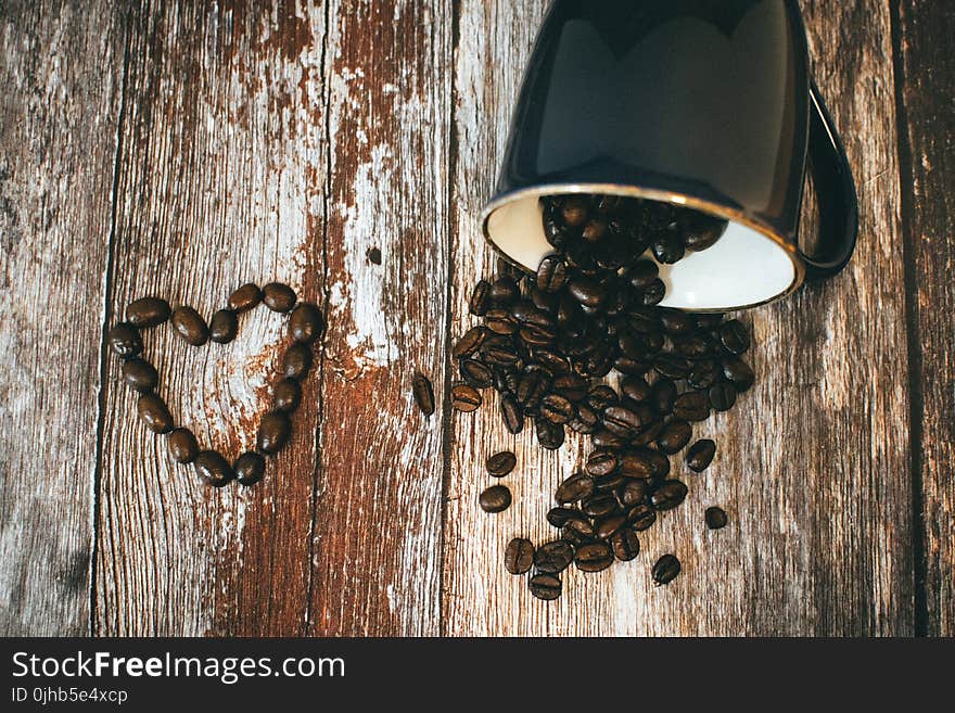 Black Ceramic Coffee Mug and Beans