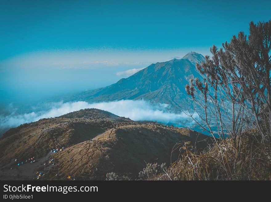 Landscape Photography of Mountain Surrounded by Sea of Clouds