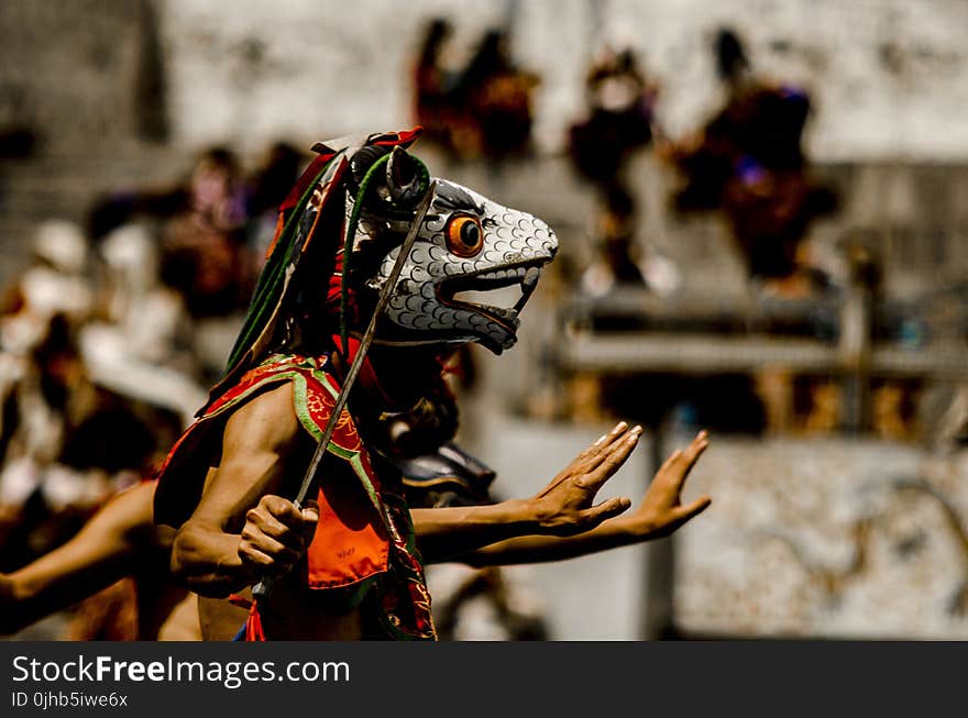 Person Wearing Traditional Mask Dancing