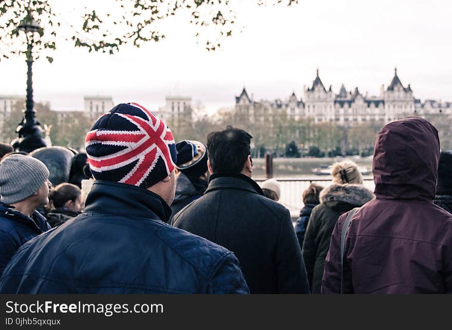 Photo of Group of People Standing in Front of Building