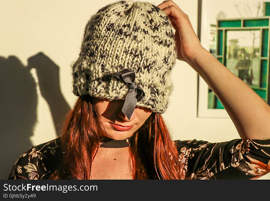 Closeup Photo of Woman Wearing White and Black Knit Cap