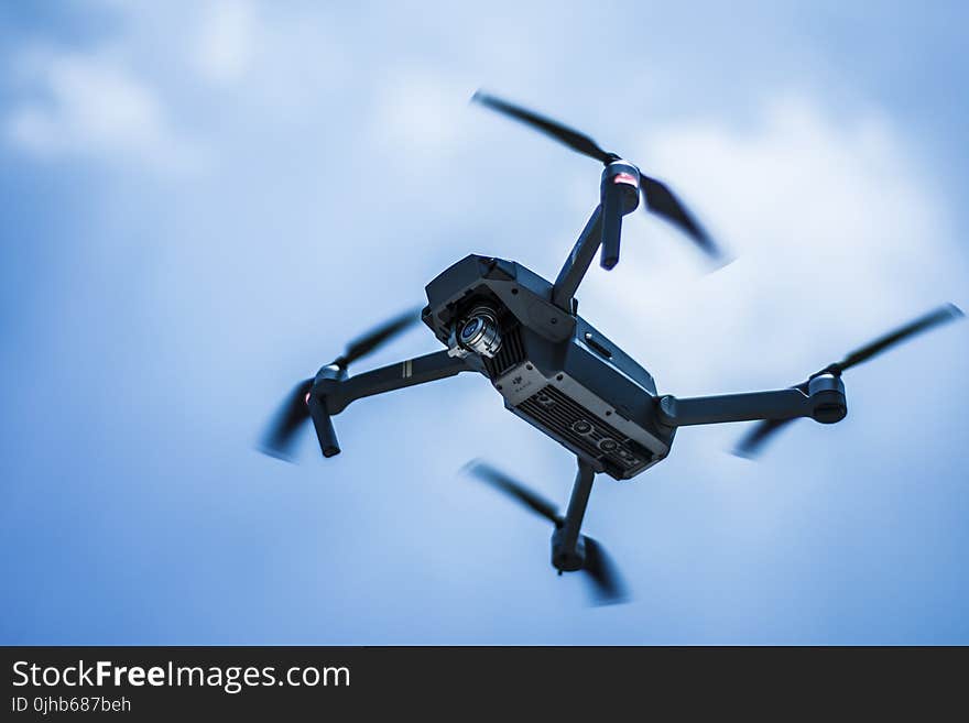 Photo of Gray Quadcopter on the Sky