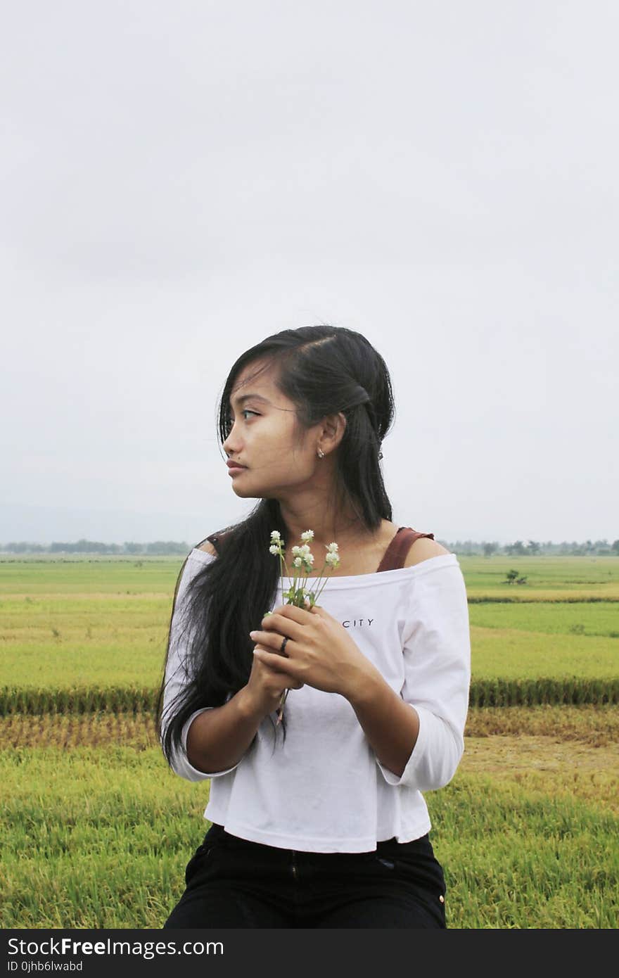 Photo of Girl in White Off-shoulder Top