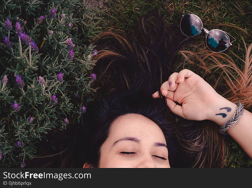 Woman Lying on Flower Field