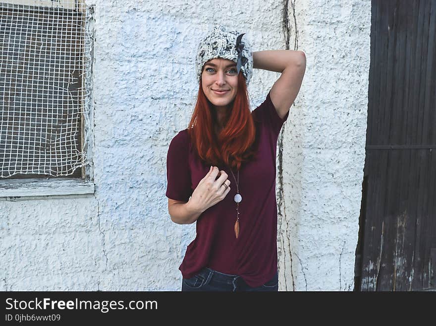 Woman in Maroon Top and Bluejeans