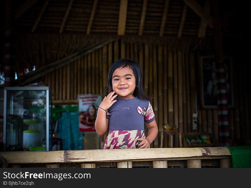 Toddler in Purple and White Dress