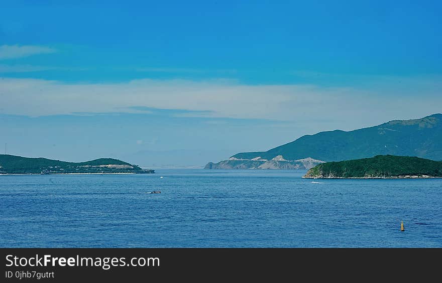 Blue Sea Near Mountains