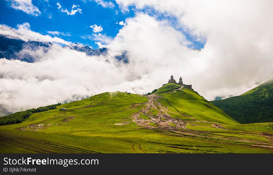 Green Mountain Under Clear Blue Sky