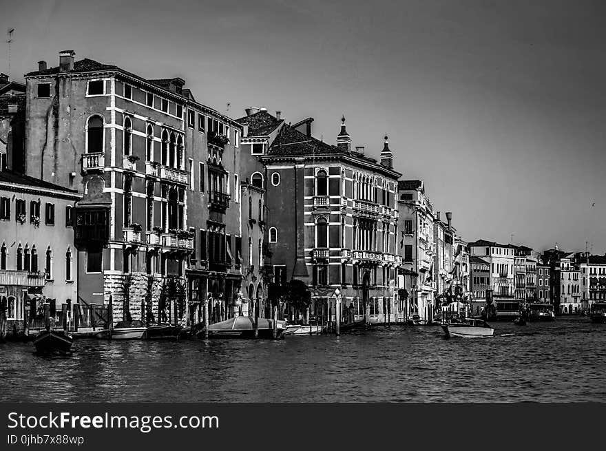 Concrete Houses Beside Body of Water