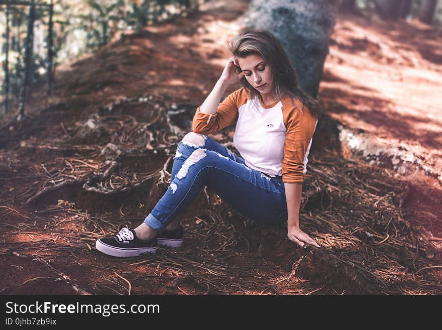 Woman Sitting On Ground