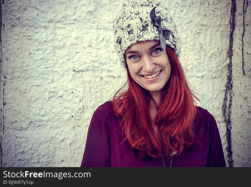 Woman With Red Hair Wears Purple Top