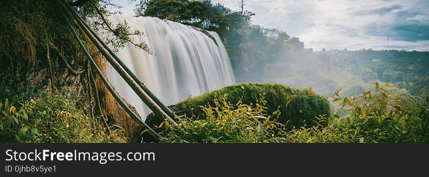 Timelapse Photo of Water Falls Between Trees