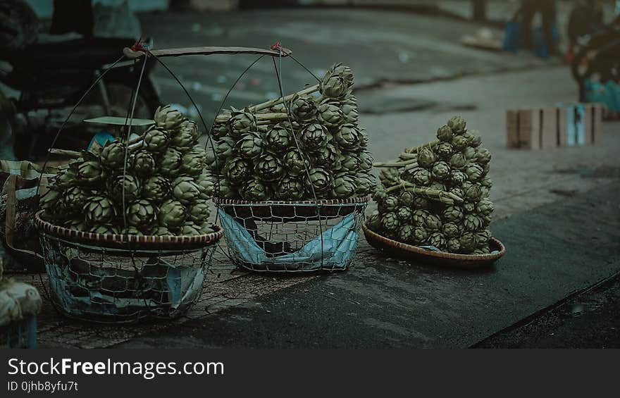 Gray Nuts With Three Baskets on Gray Table