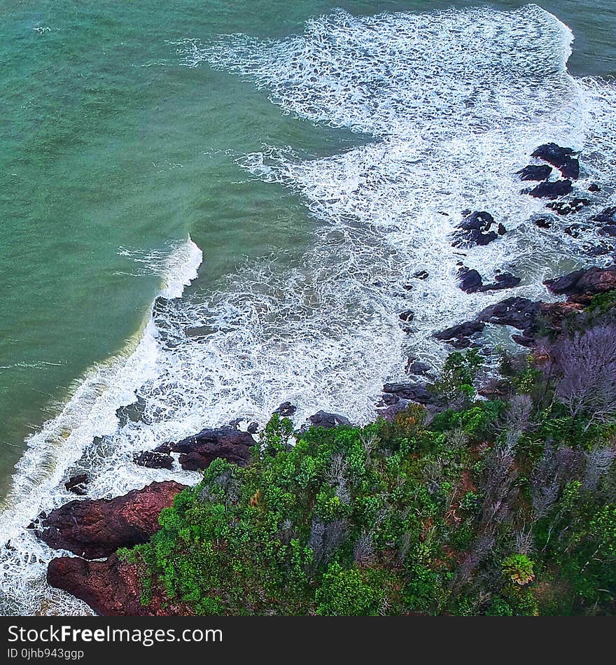 Aerial Photography of Seashore Beside Islet