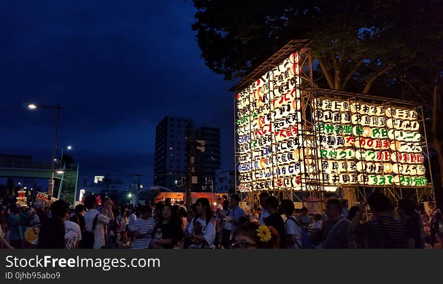 Group of People Near Multicolored Lantern Display