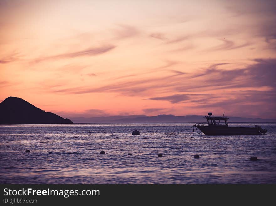 Boat on Sea during Golden Hour