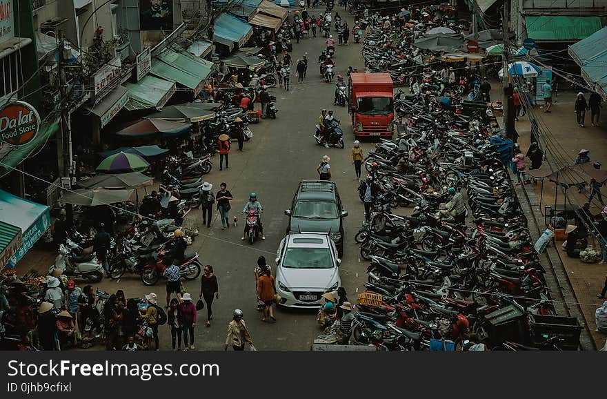 Group of People Walking Through Market