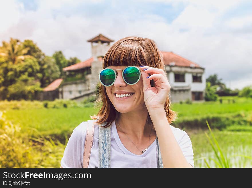 Woman Wearing Green Sunglasses