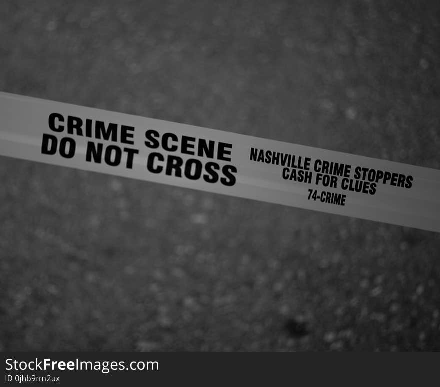 Grayscale Photo of Crime Scene Do Not Cross Tape