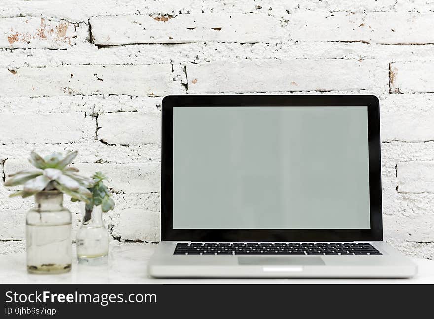 Macbook Pro on White Surface