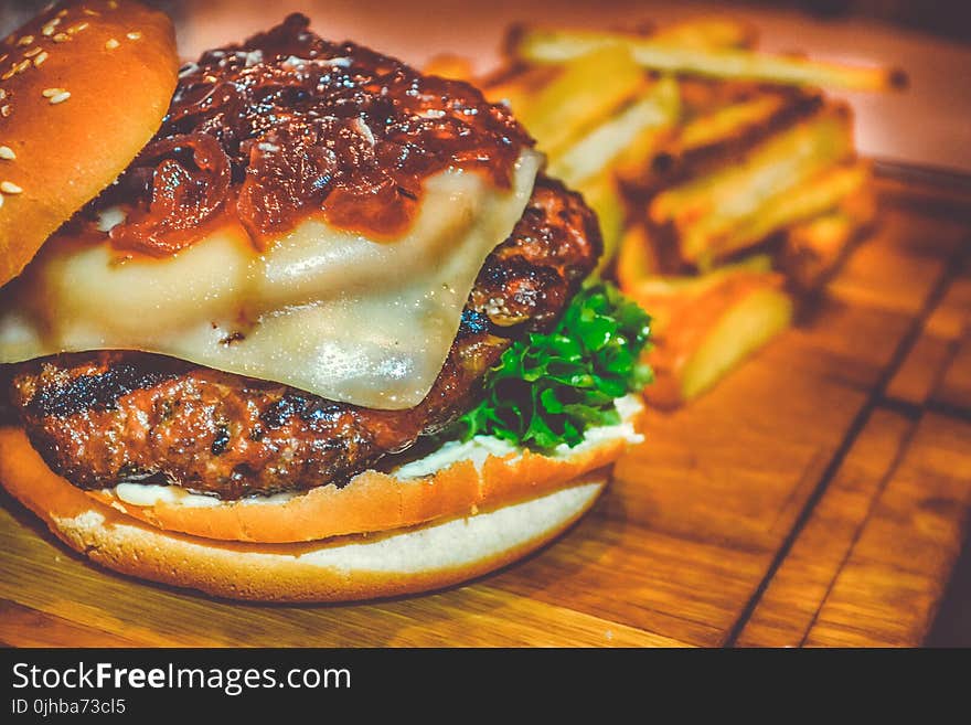 Selective Focus of Ham Burger on Wooden Surface Photo