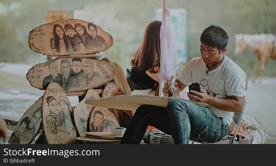 Man in White Shirt Painting