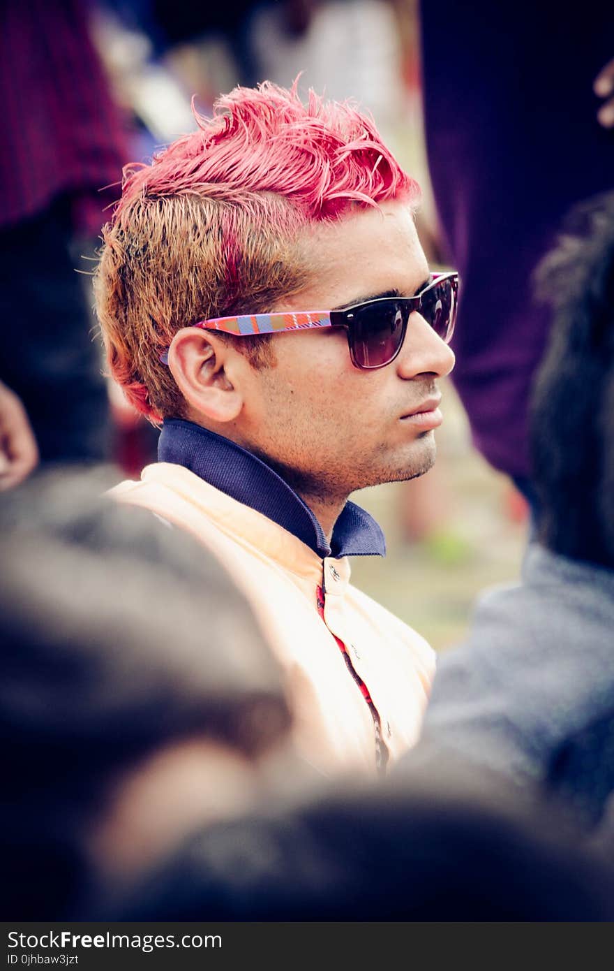 Man Wearing White Top and Black Wayfarer Sunglasses