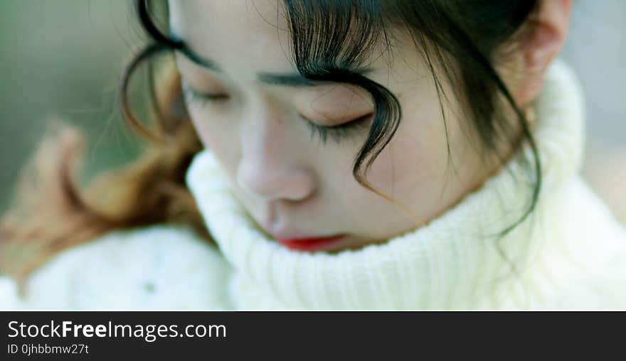 Close Up Photo of Woman in White Turtle Neck Top