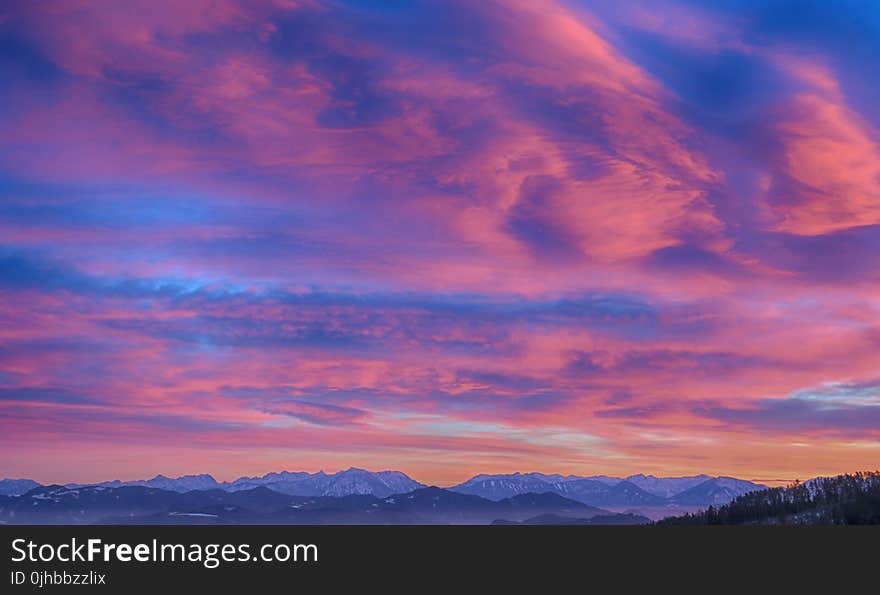 Snow Cap Mountain Under Nimbus Clouds