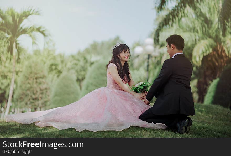 Couple Sitting on Grass