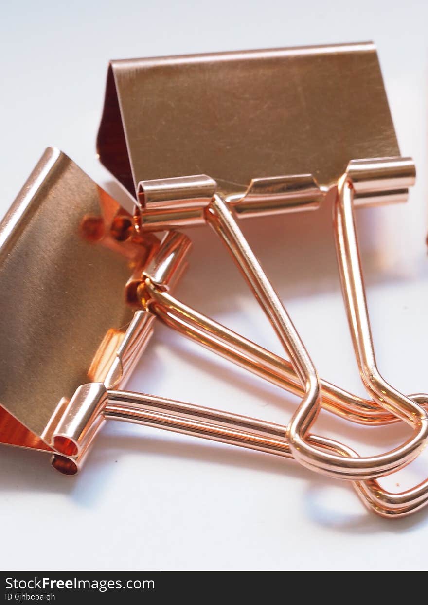 Two Gold Binder Clips