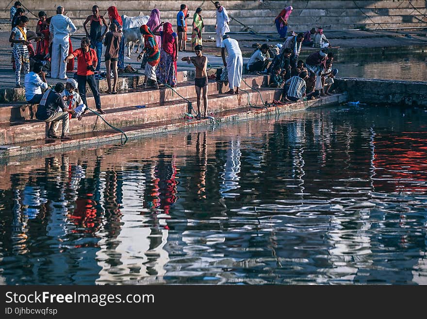 People Near Body Of Water