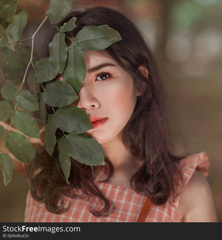 Girl in Orange and White Gingham Sleeveless Dress Close-up Photo