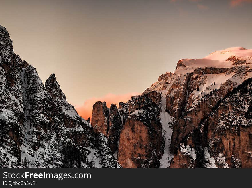 Brown and Gray Snow-covered Mountains