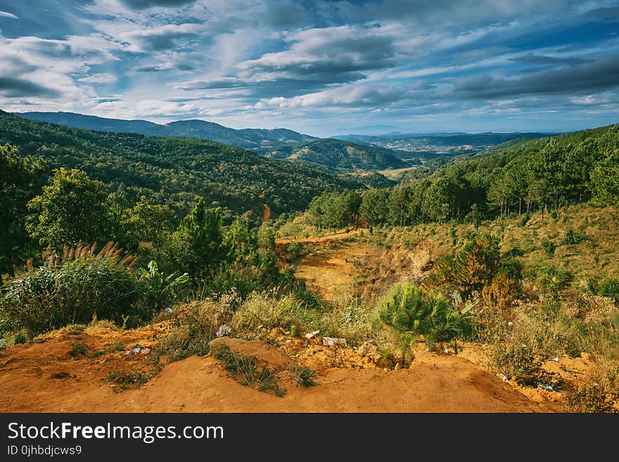 Scenic View of Mountains Under Cloudy Sky