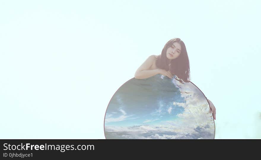 Woman Covering Her Body With Round Blue Panel Boar