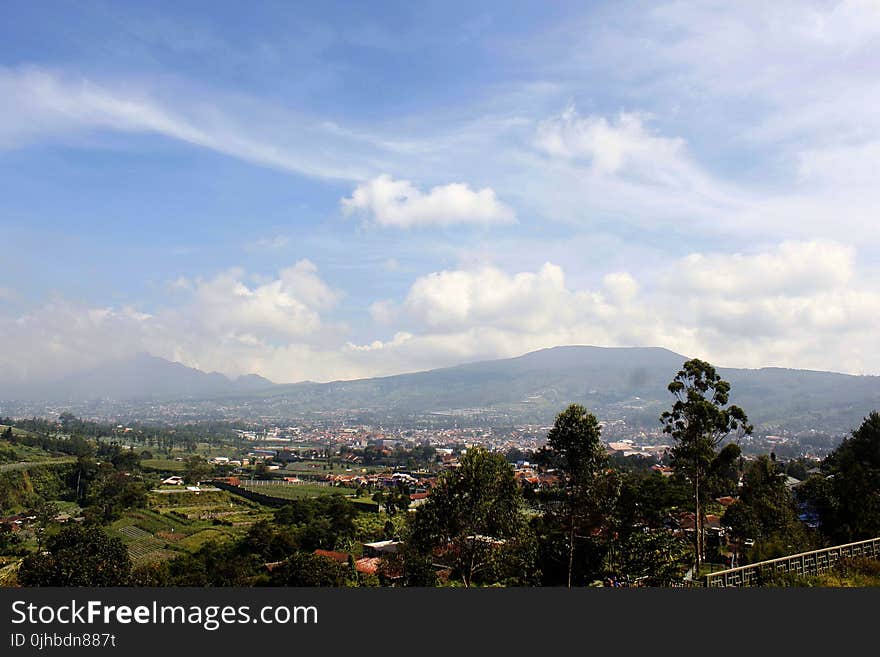 Aerial View of City and Mountain at Distance