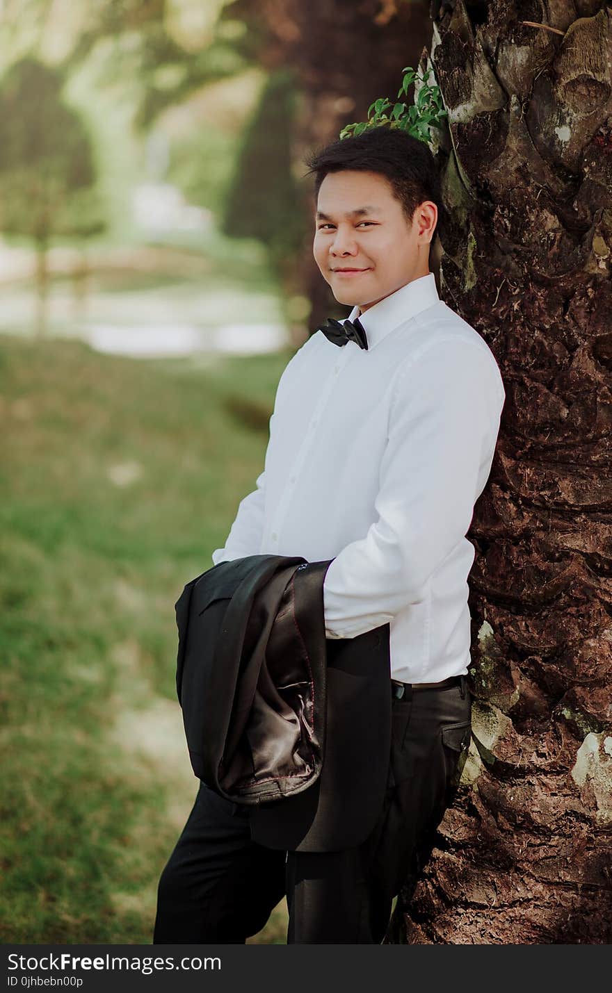 Man Wearing White Dress Shirt Posing for Photo